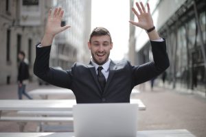 man in black suit jacket raising his both hand 3779427